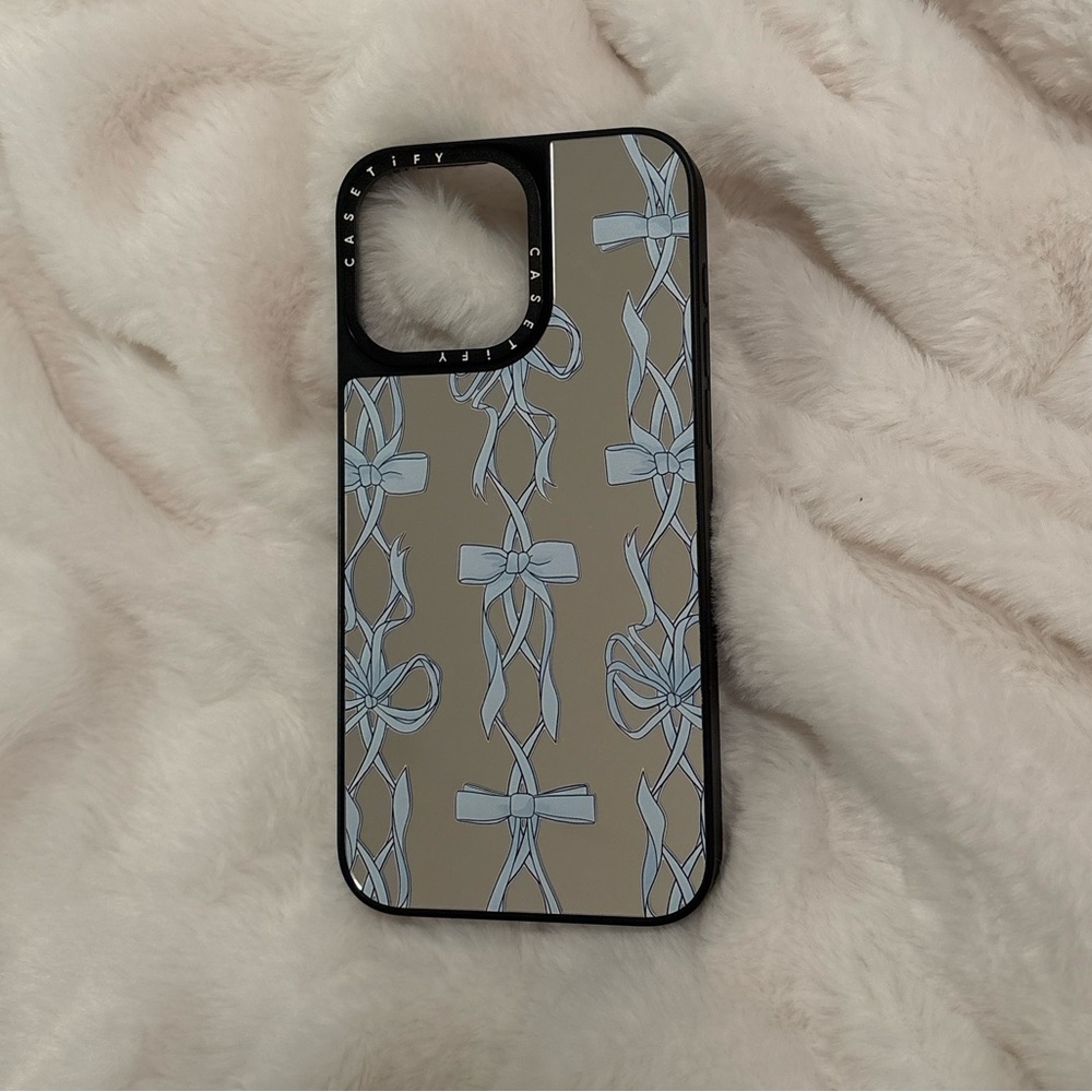 Casetify Black and reflective Phone Case with Blue Ribbon Design iPhone 15 pro